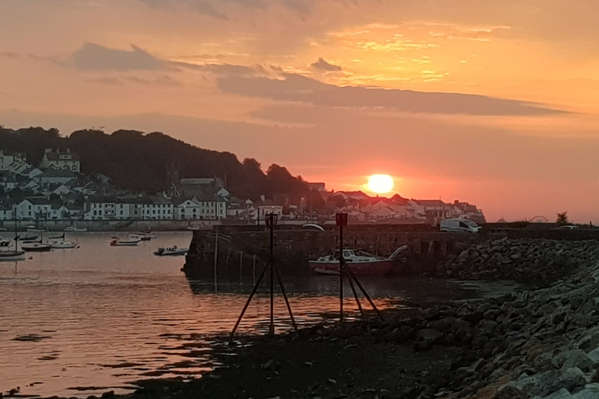 Sunset at Instow across the harbour wall